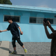 Two boys shake hands at the replica of the truce village of Panmunjom at a movie studio in Namyangju, South Korea.